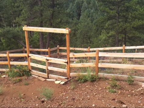Picture of a four foot custom cedar split rail corral with double doors built by The Montross Brothers in Jefferson County, Colorado